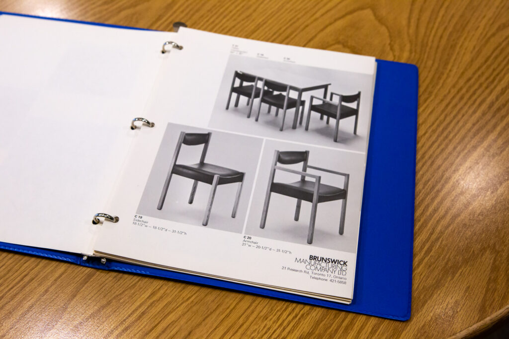 Archival binder with chair images. 
